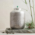 Pure 999 Fine Silver Elegant Silver-Toned Jar with Intricate Landscape Relief and Jade Finial - Handicraft