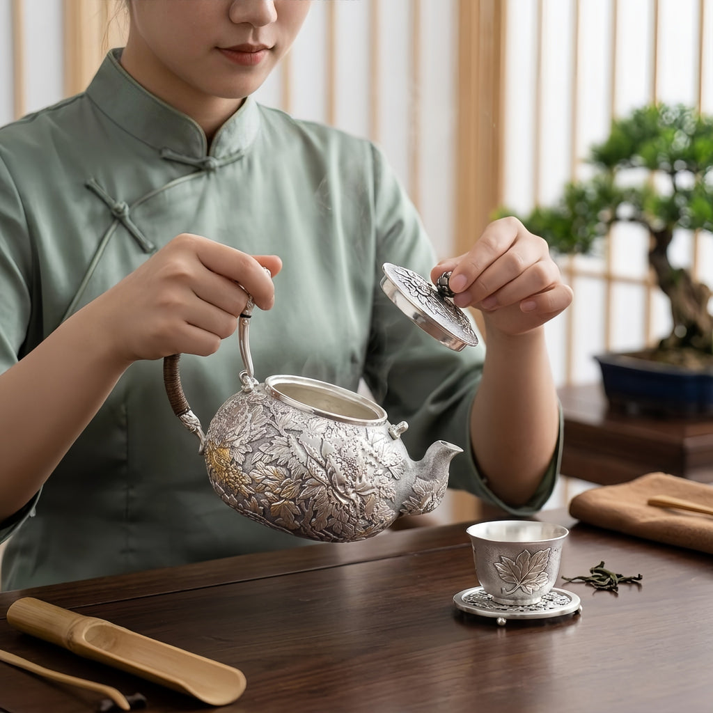 Pure 999 Fine Silver Handcrafted Silver Teapot with Intricate Floral Relief and Rattan-Wrapped Handle - Handicraft