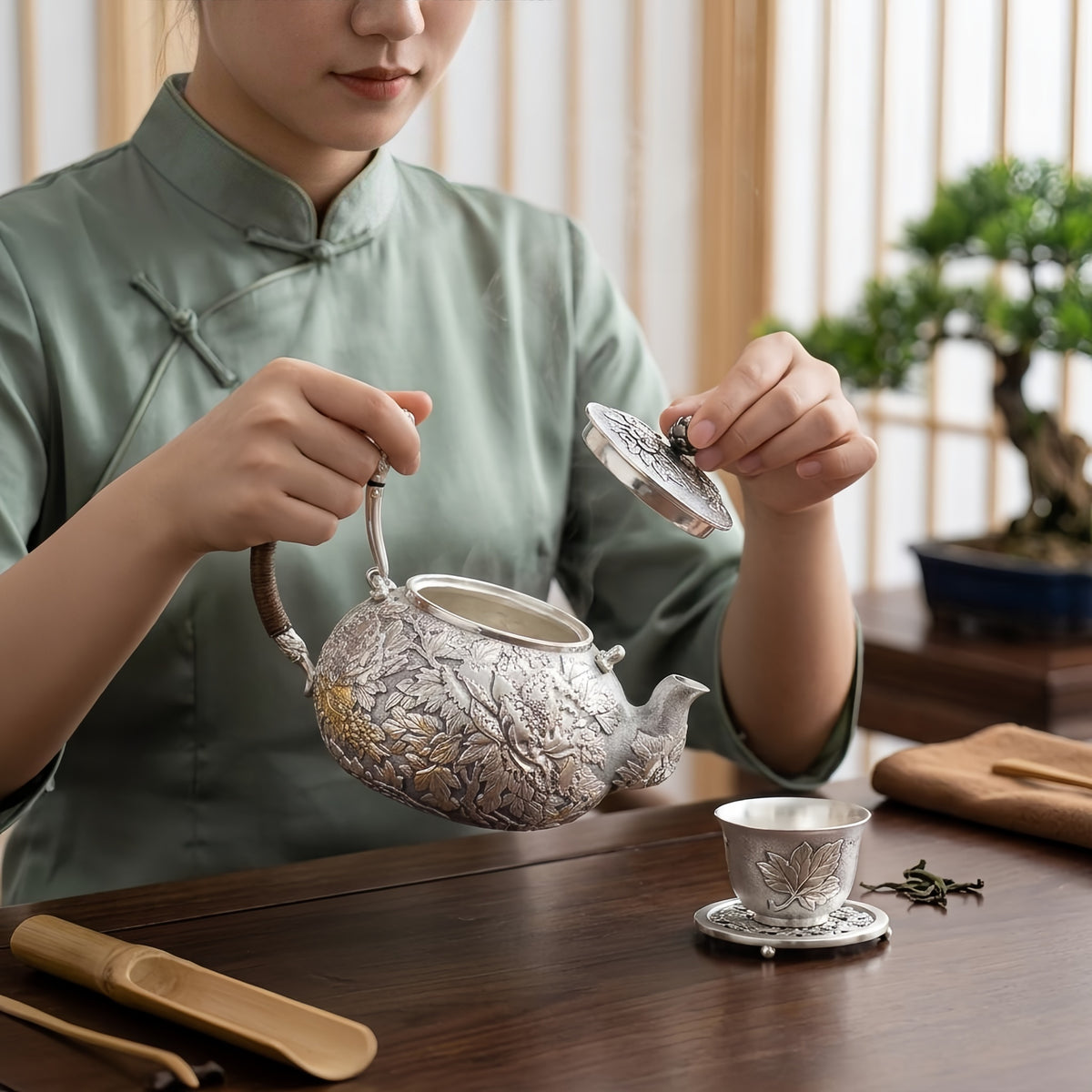 Pure 999 Fine Silver Handcrafted Silver Teapot with Intricate Floral Relief and Rattan-Wrapped Handle - Handicraft