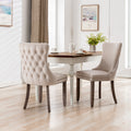 A A Upholstered Wing-Back Chair With Nailhead Trim & Solid Wood Leg