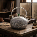 Pure 999 Fine Silver Handcrafted Silver Teapot Featuring Intricate Peony and Bird Relief with a Green Jade Finial - Handicraft