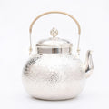 Pure 999 Fine Silver Handcrafted Hammered Silver Teapot with Rattan-Wrapped Handle and Filigree Finial - Handicraft